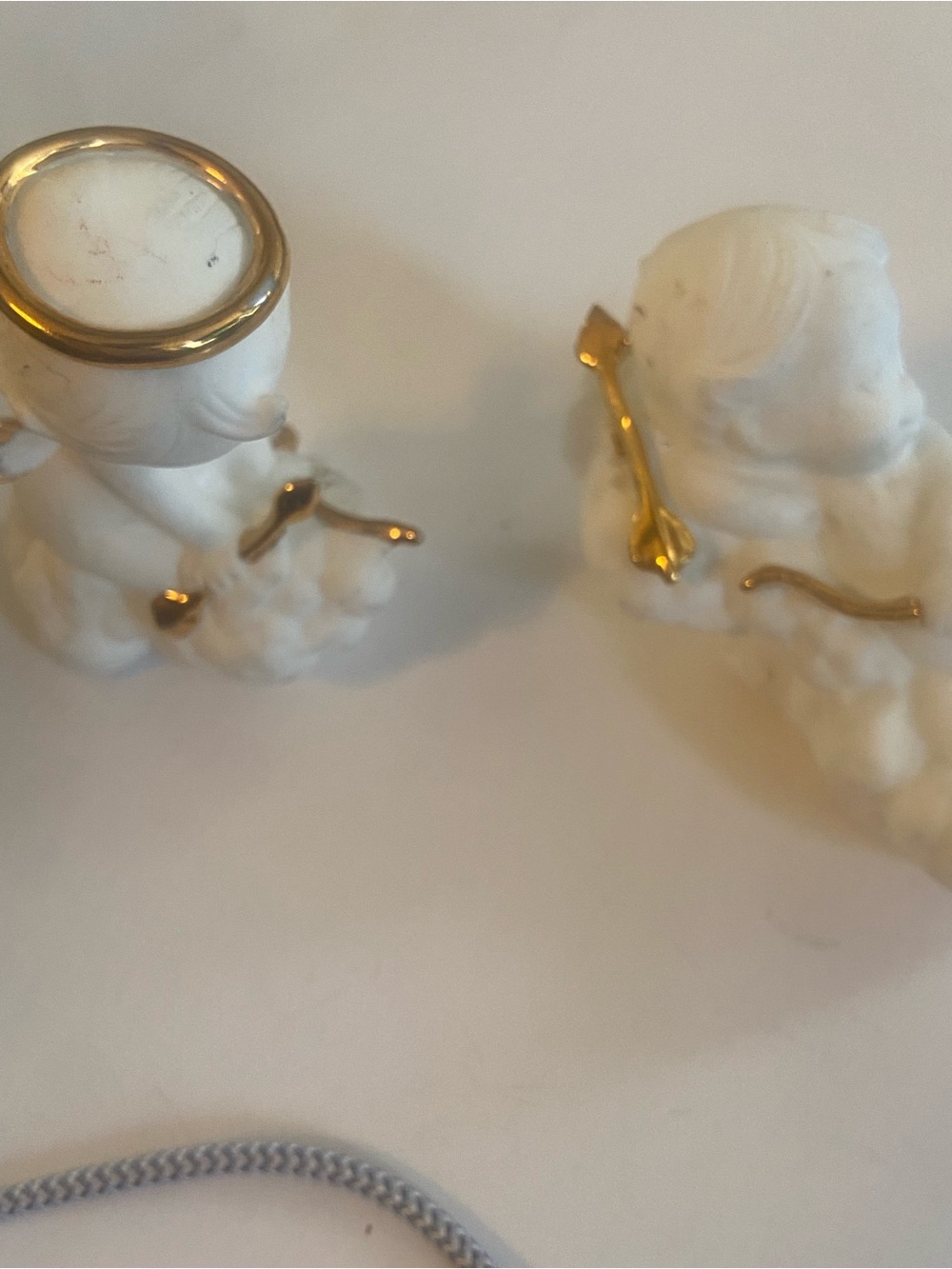 White Porcelain Cherub Figurine Pair with Gold Accents